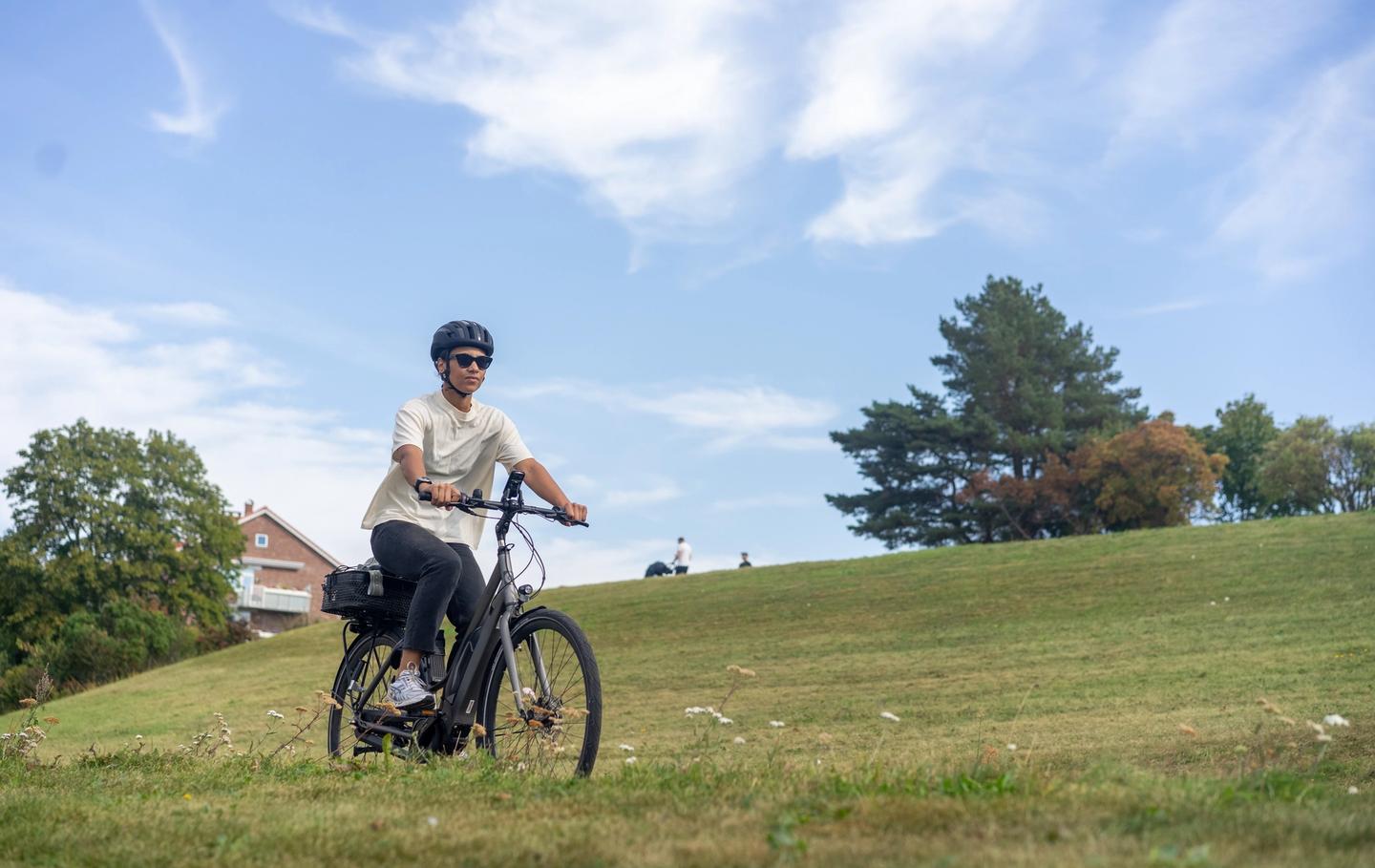 Woman on bike on field